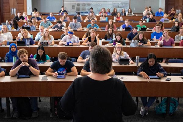 Lecturer at the front of the classroom