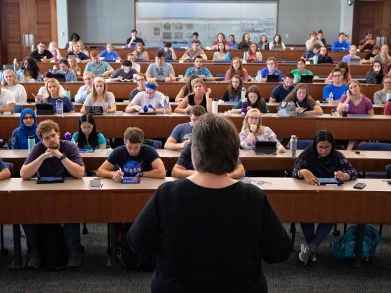 Lecturer at the front of the classroom